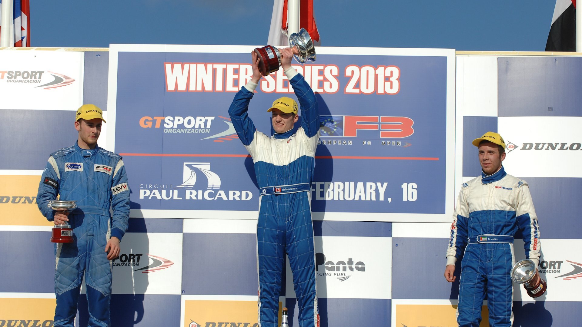 Nelson Mason lifting the winner’s trophy at the 2013 European F3 Winter Series, Paul Ricard