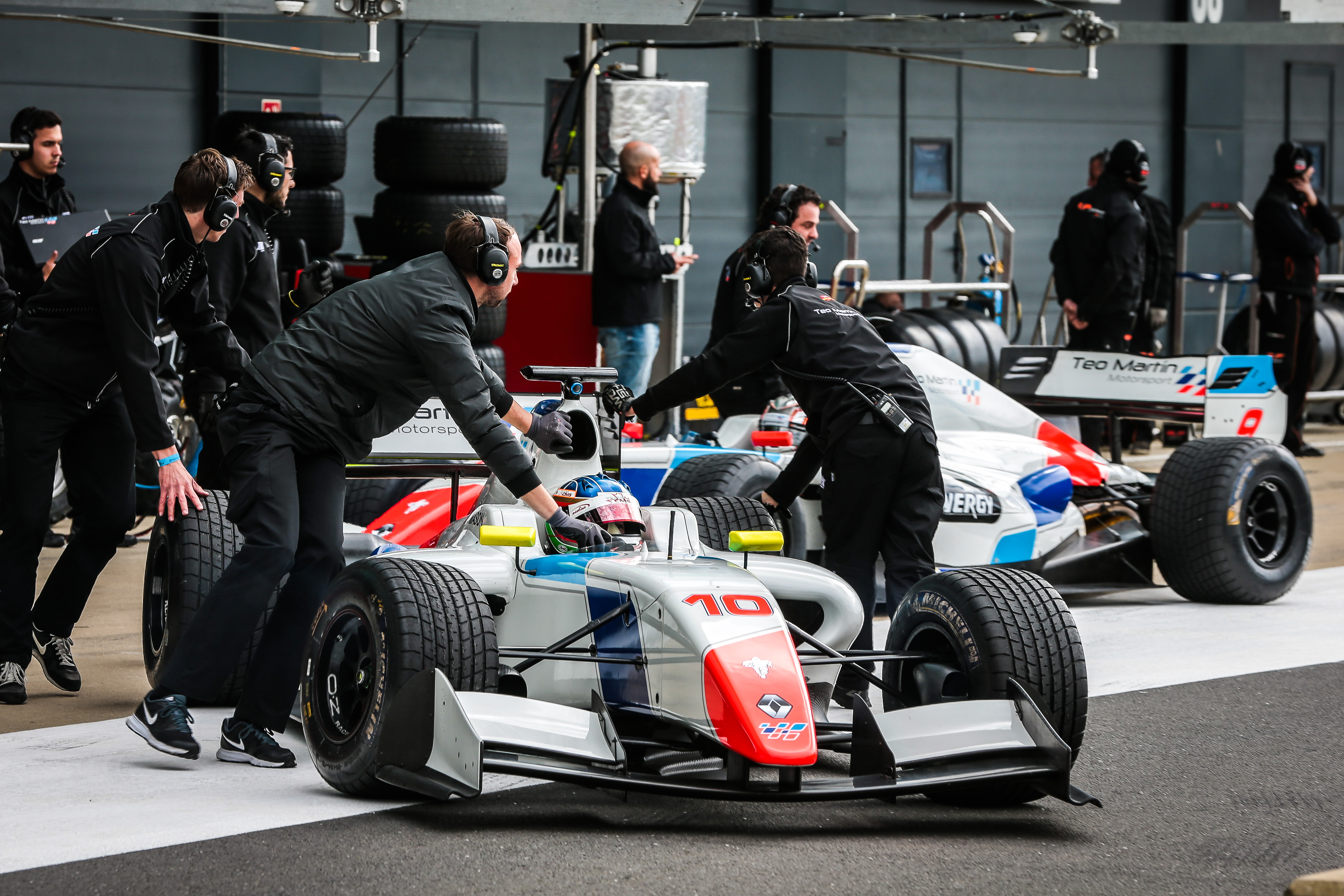 Nelson Mason in the number 10 Teo Martín Motorsport car as the team prepares to leave the garage at Silverstone